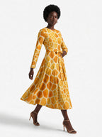 "Twiga" Long Sleeve Midaxi Dress — three-quarter view on model, hand in the side pocket