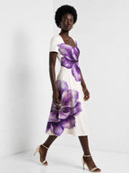 "Ua" Sweetheart Midi Dress — walking, three-quarter view on model