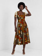 "Ufundi" Sweetheart Midi Dress — styled on model