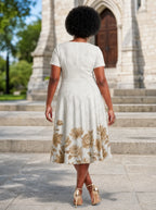 "Ukungu" Sweetheart Midi Dress — back view on model in the churchyard