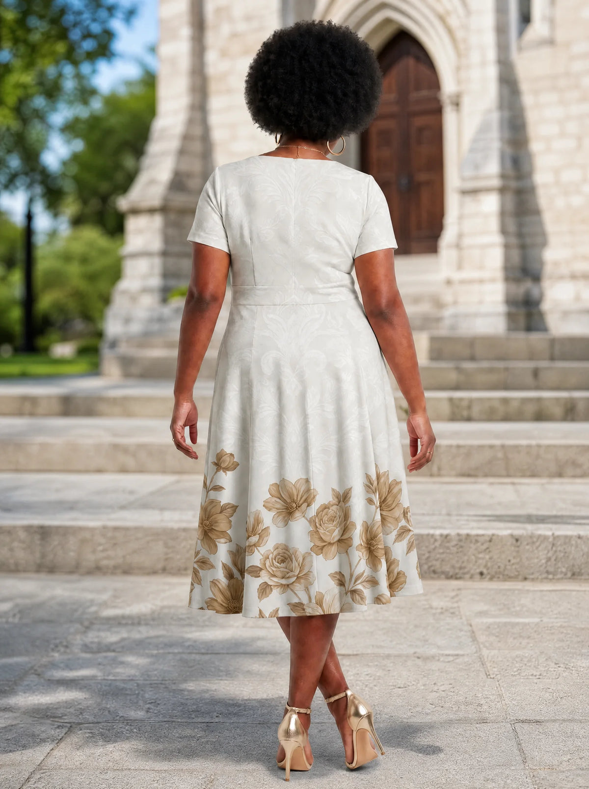 "Ukungu" Sweetheart Midi Dress — back view on model in the churchyard
