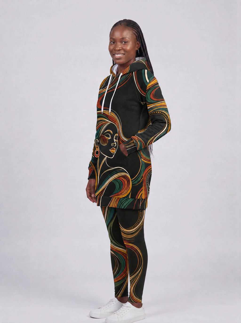"Upepo" Hoodie Dress — three-quarter view on model, hand in pocket, styled with the matching leggings