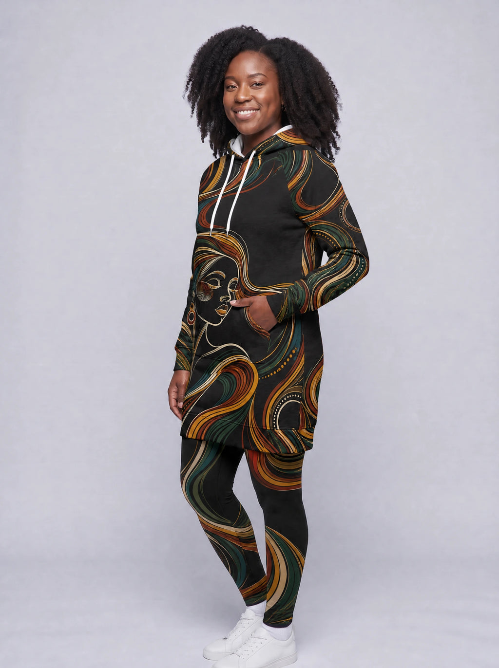 "Upepo" Hoodie Dress — three-quarter view on model, hand in pocket, styled with the matching leggings