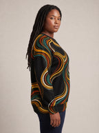 "Upepo" Sweatshirt — side view on model