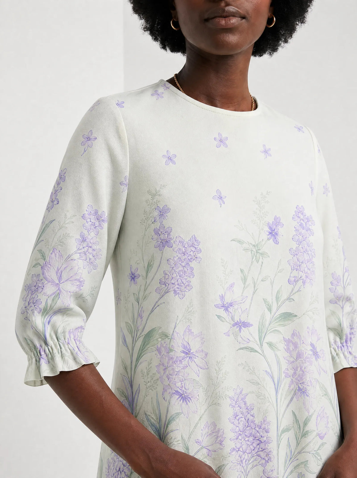 "Urujuani" Long Sleeve Maxi Dress — close-up of the high round neckline