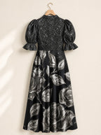 "Usiku" Puff Sleeve Dress — the dress on a hanger, back