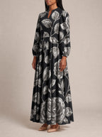 "Usiku" Puff Sleeve Maxi Dress — three-quarter view on model