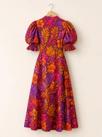 "Waridi" Puff Sleeve Dress — the dress on a hanger, back
