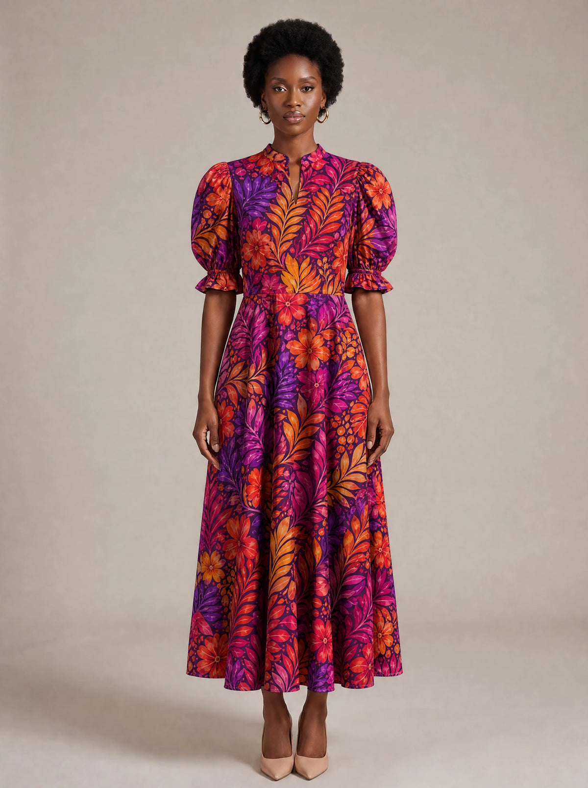 "Waridi" Puff Sleeve Dress — standing, angled view on model