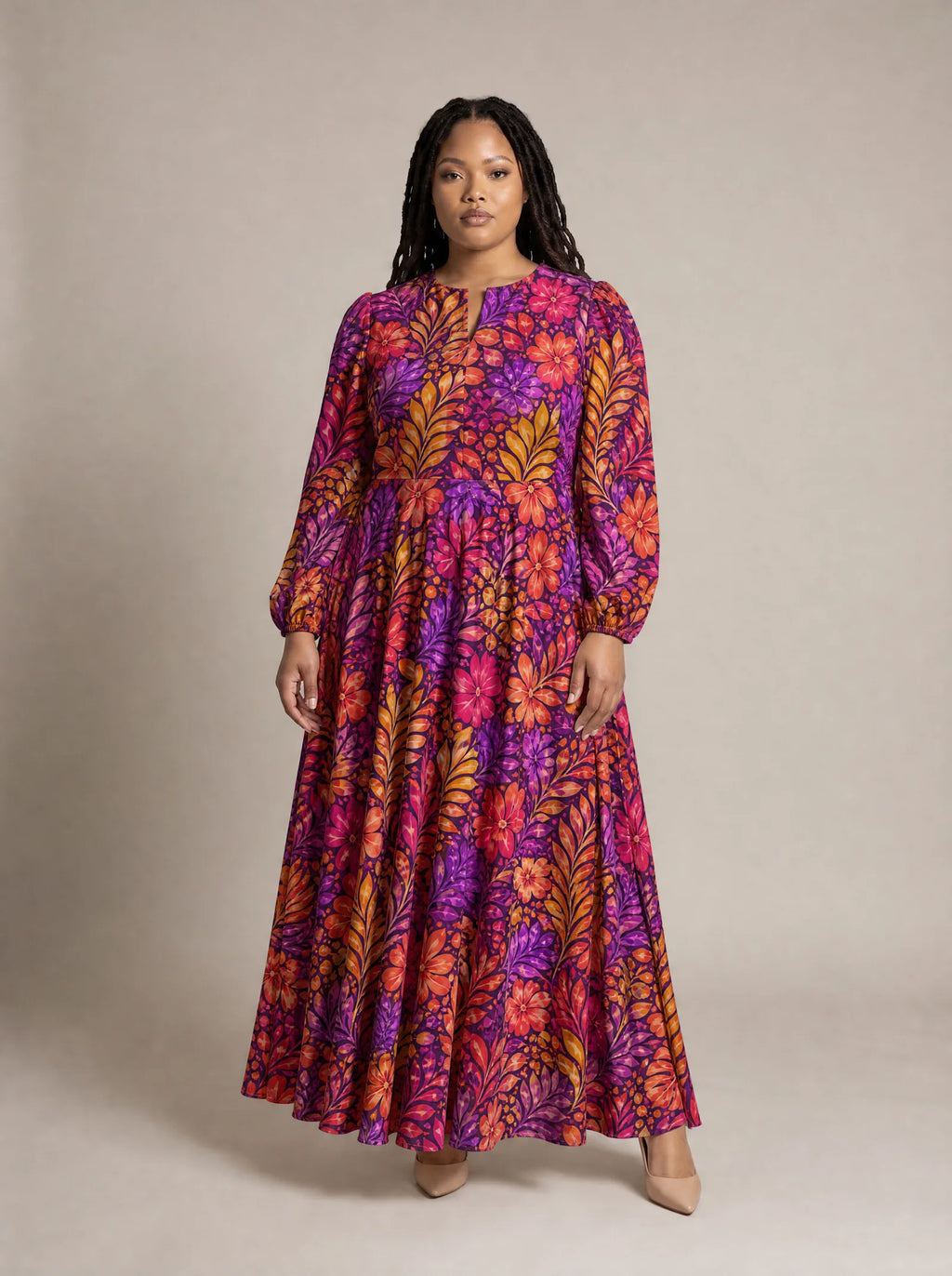 "Waridi" Puff Sleeve Maxi Dress — standing, angled view on model