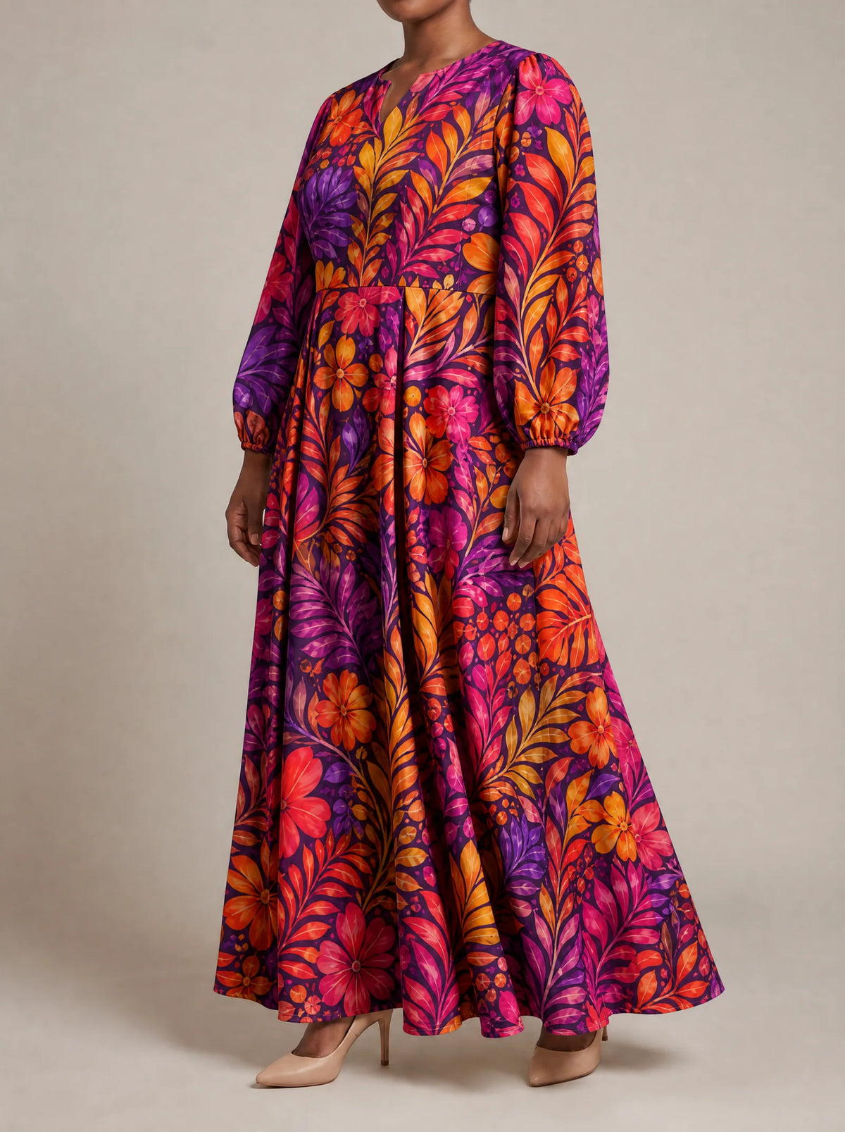 "Waridi" Puff Sleeve Maxi Dress — three-quarter view on model