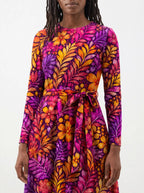 "Waridi" Long Sleeve Midaxi Dress — close-up of the tie sash and the in-seam side pocket