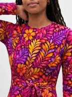 "Waridi" Long Sleeve Midaxi Dress — close-up of the round neckline and long sleeve