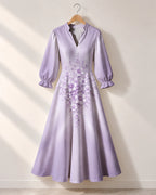 "Zambarau" Long Puff Sleeve Dress — the dress on a hanger, front