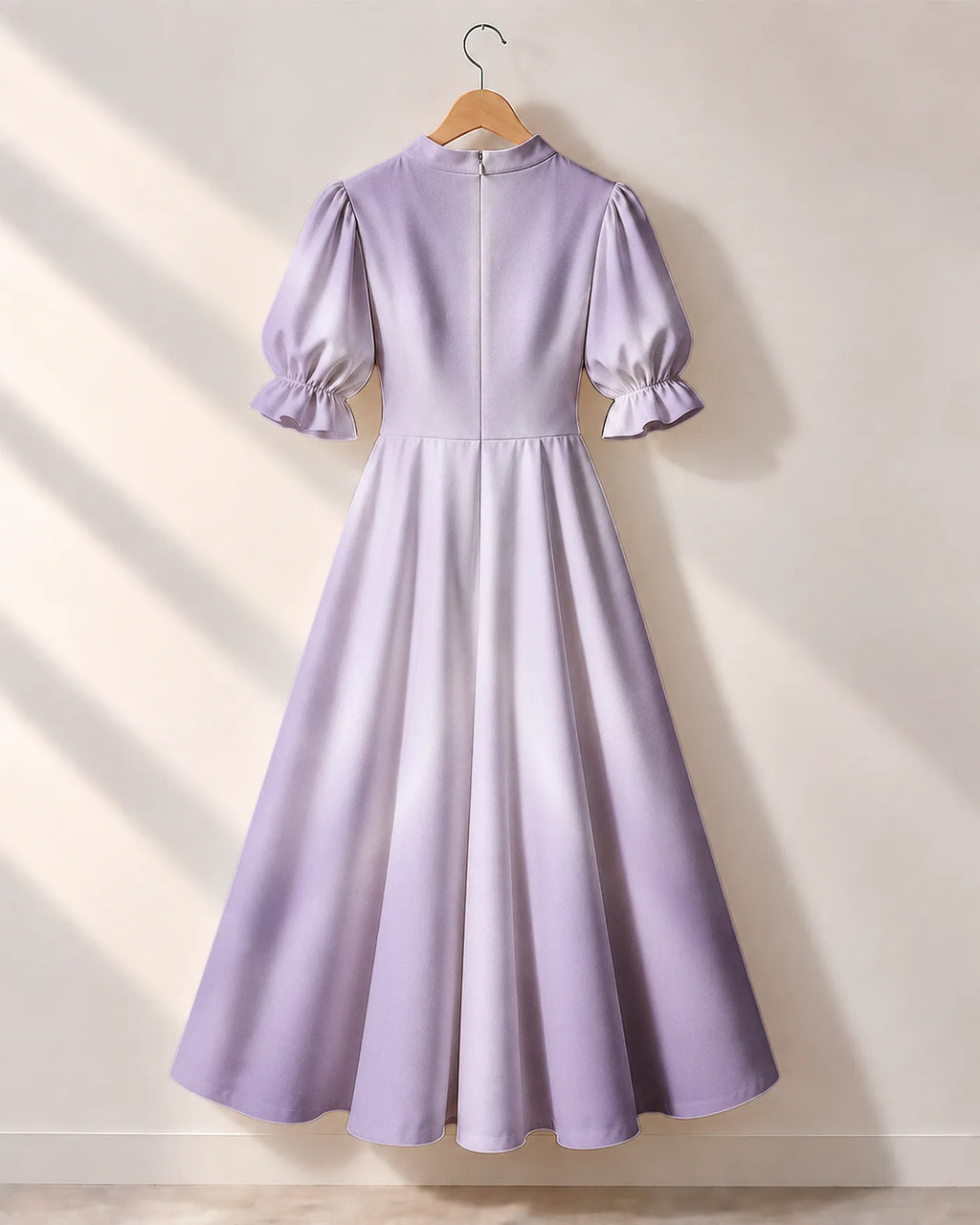 "Zambarau" Puff Sleeve Dress — the dress on a hanger, back