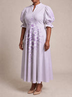 "Zambarau" Puff Sleeve Dress — three-quarter view on model