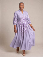 "Zambarau" Puff Sleeve Maxi Dress — walking, three-quarter view on model