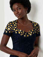 "Zawadi" Sweetheart Midi Dress — three-quarter view on model