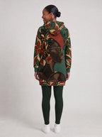"Zuhura" Hoodie Dress — side view on model, styled with the matching leggings