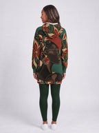 "Zuhura" Hoodie Dress — back view on model, styled with the matching leggings