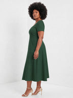 "Zuhura" Sweetheart Midi Dress — side view on model