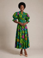 "Zumaridi" Puff Sleeve Dress — walking, three-quarter view on model
